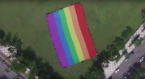 LGBT supporters unfurl rainbow flag to mark national day in Taiwan